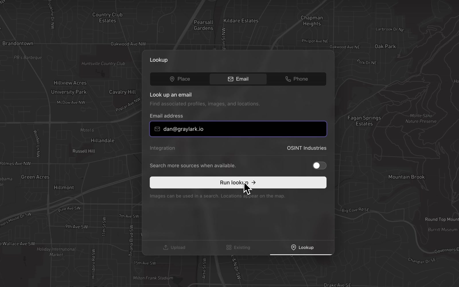 Raven’s Lookup panel over a dark street map. Tabs for Place, Email, and Phone, with Email selected. A heading reads Look up an email, find associated profiles, images, and locations. An email address is entered, the integration is listed as OSINT Industries, and the cursor rests on a Run lookup button.